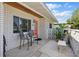 Cozy front porch with brick accents, seating, and decorative lattice at 1005 Catalpa Ln, Orlando, FL 32806