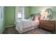 Inviting bedroom with light green walls, comfortable bed, and tasteful decor at 1918 Clear Sky Dr, Kissimmee, FL 34744