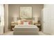 Bedroom with neutral tones, stylish decor, and bedside tables with lamps at 286 Puma Loop, Groveland, FL 34736