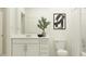 A well-lit bathroom featuring a white vanity, modern fixtures, and a soothing neutral color palette at 4220 Singing Mockingbird Blvd, Bartow, FL 33830