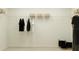 Spacious walk-in closet with a wire shelf, hanging clothes and storage baskets at the top at 4220 Singing Mockingbird Blvd, Bartow, FL 33830