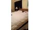 Bedroom with white bedding and black out curtains at 602 Hillcrest Dr, Davenport, FL 33897