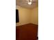 Bedroom with hardwood floors, ceiling fan and yellow painted walls at 602 Hillcrest Dr, Davenport, FL 33897