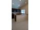 Spacious kitchen featuring dark cabinetry, tile floor, and ample counter space at 602 Hillcrest Dr, Davenport, FL 33897
