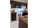 Well-equipped kitchen with sleek cabinets and modern appliances at 602 Hillcrest Dr, Davenport, FL 33897