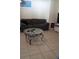 Inviting living room with tile floors and comfy sofa for relaxation at 602 Hillcrest Dr, Davenport, FL 33897
