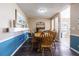 Bright dining room featuring wooden table, chairs, and stylish coastal decor at 6125 Morningdale Ave, Lakeland, FL 33813