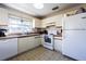 Well-lit kitchen with appliances and window at 6125 Morningdale Ave, Lakeland, FL 33813