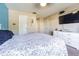 Main bedroom featuring neutral walls, lots of natural light and tv at 6125 Morningdale Ave, Lakeland, FL 33813
