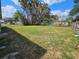 Expansive backyard with chain link fence, perfect for pets and outdoor activities at 1011 Old Lake Alfred Rd, Auburndale, FL 33823