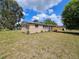 Beautiful brick single-story home with well-manicured lawn and covered area at 1011 Old Lake Alfred Rd, Auburndale, FL 33823