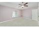 Bedroom featuring neutral carpeting and a window that provides natural light and ventilation at 2076 Whispering Trails Blvd, Winter Haven, FL 33884