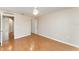 Spacious bedroom featuring hardwood floors, a ceiling fan, and a closet at 2076 Whispering Trails Blvd, Winter Haven, FL 33884