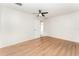 Bedroom featuring wood-look flooring, modern ceiling fan, and neutral walls at 265 Elderberry Dr, Davenport, FL 33897