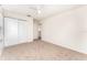 Bedroom featuring neutral carpet, a ceiling fan, and large closet at 265 Elderberry Dr, Davenport, FL 33897