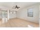 Open living room with tile flooring, a ceiling fan, and natural light from the window at 265 Elderberry Dr, Davenport, FL 33897