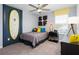 Bright bedroom with surfboard decoration, ceiling fan, and colorful accents at 5645 Meditation Dr, Clermont, FL 34714