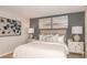 Cozy bedroom featuring a plush bed, neutral decor, and bedside tables with lamps at 1920 Rosewood Cir, Lakeland, FL 33810