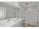 Bathroom with double sink vanity, quartz counters and shower-tub combination at 1018 Foreshore Ln, Haines City, FL 33844
