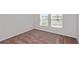 Bright bedroom with plush carpeting, neutral walls and bright windows overlooking the neighborhood at 1018 Foreshore Ln, Haines City, FL 33844