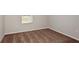 Bedroom with neutral walls, trim, and carpeting illuminated by a window at 1018 Foreshore Ln, Haines City, FL 33844
