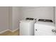 Convenient laundry area with modern washer and dryer, and wire shelving for organization at 1018 Foreshore Ln, Haines City, FL 33844