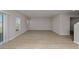Bright, open living room with wood-look floors and abundant natural light at 1018 Foreshore Ln, Haines City, FL 33844