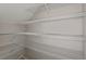 Spacious walk-in pantry with ample shelving for organized storage at 1018 Foreshore Ln, Haines City, FL 33844