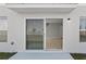 Outdoor patio featuring sliding glass door entry to interior at 1018 Foreshore Ln, Haines City, FL 33844