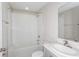 Bright bathroom with combined bathtub and shower, single sink with countertop, toilet, and mirrored cabinet at 1026 Foreshore Ln, Haines City, FL 33844