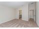 Bedroom featuring neutral walls and plush carpet, with doorways leading to an en-suite bathroom and a walk-in closet at 1026 Foreshore Ln, Haines City, FL 33844