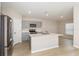 Modern kitchen with stainless steel appliances, gray cabinets, an island, and sleek countertops at 1026 Foreshore Ln, Haines City, FL 33844