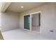 Covered patio featuring a sliding glass door entry that offers seamless indoor-outdoor living at 1026 Foreshore Ln, Haines City, FL 33844