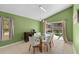Dining room with a glass table, chairs, and sliding glass doors to a pool at 112 Thorne Meadow Pass, Davenport, FL 33897