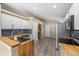 Modern kitchen featuring butcher block counters, stainless appliances, and abundant cabinet space at 112 Thorne Meadow Pass, Davenport, FL 33897