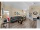 Comfortable living room with modern decor, offering ample natural light and hardwood floors at 112 Thorne Meadow Pass, Davenport, FL 33897