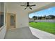 Covered back porch overlooking a well-maintained yard at 17745 Sw 25Th Ave Rd, Ocala, FL 34473