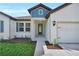 Charming single-story home with a well-manicured lawn and inviting front entrance at 17745 Sw 25Th Ave Rd, Ocala, FL 34473