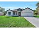 Charming single-story home featuring a well-manicured lawn and welcoming curb appeal at 17745 Sw 25Th Ave Rd, Ocala, FL 34473