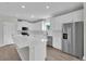 Modern kitchen boasts stainless steel appliances, white cabinets, and quartz countertops at 17745 Sw 25Th Ave Rd, Ocala, FL 34473
