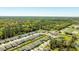 Aerial view shows a neighborhood with single-Gathering homes, lawns, trees and community landscaping at 2047 Rosewood Cir, Lakeland, FL 33810