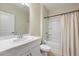 Bright bathroom featuring white vanity and tub with shower at 2047 Rosewood Cir, Lakeland, FL 33810