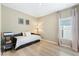 Bedroom with hardwood flooring and a daybed by a large window at 2047 Rosewood Cir, Lakeland, FL 33810