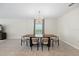 Bright dining area features a sleek table, modern chandelier, and an inviting atmosphere at 2047 Rosewood Cir, Lakeland, FL 33810