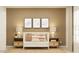 Charming Bedroom features western themed art above a white crib, side tables with lamps, and a soft neutral color palette at 1261 Deepwater Cir, Eagle Lake, FL 33839