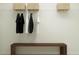 Organized closet space with a simple storage solution and a sleek, minimalist bench at 1261 Deepwater Cir, Eagle Lake, FL 33839