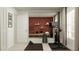 Well-equipped home gym featuring a stationary bike, weights, and a large mirror, perfect for fitness enthusiasts at 1261 Deepwater Cir, Eagle Lake, FL 33839