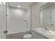 Bathroom with white fixtures, combination shower-tub and single vanity at 1538 Sage Ave, Haines City, FL 33844