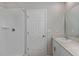 Bathroom featuring a shower with white tiles, single sink and vanity at 1538 Sage Ave, Haines City, FL 33844