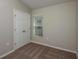 Bedroom with a window, carpeting, base trim, and a closet with double doors at 1542 Sage Ave, Haines City, FL 33844